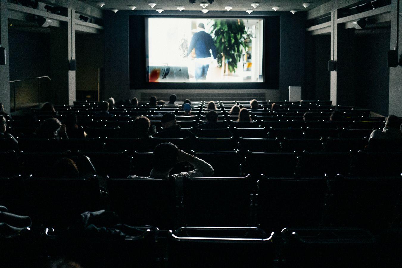 Screening of Rirkrit Tiravanija's film "Chew the Fat" during the Long Evening in the Gropius Bau cinema.