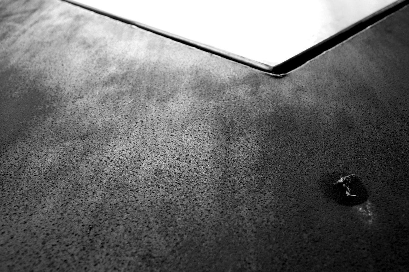 A porous grey wall