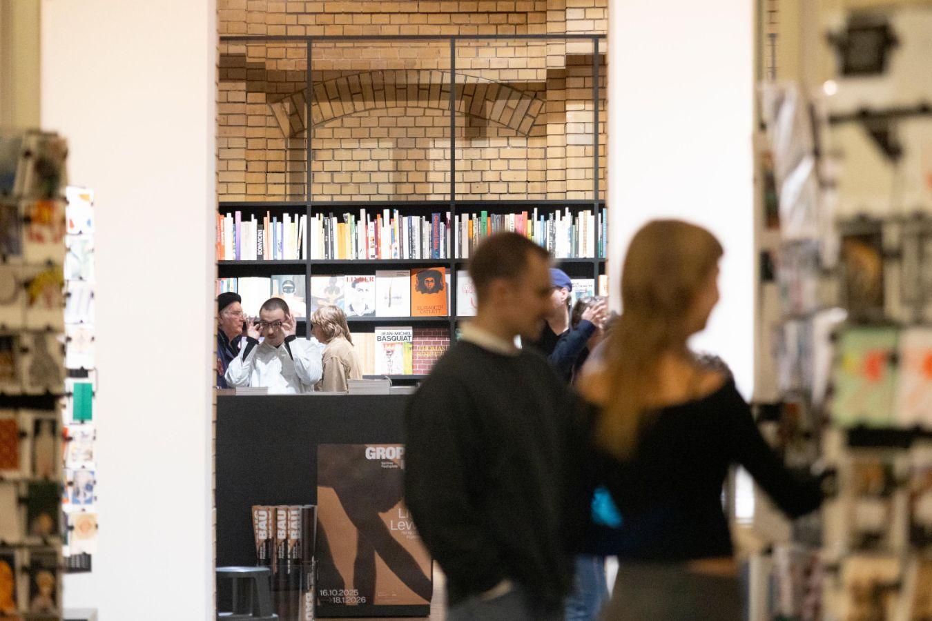 Visitors browsing in the Walther König bookstore at Gropius Bau.
