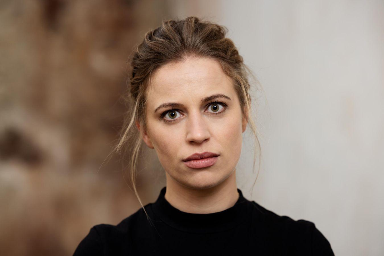 Portrait of Vanessa Porter, her head slightly tilted and her hair loosely tied back