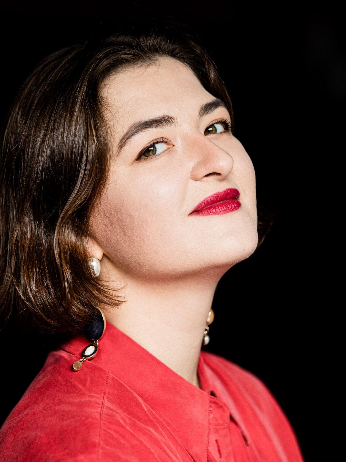 Portrait: Felsberga smiles and leans her head back slightly.