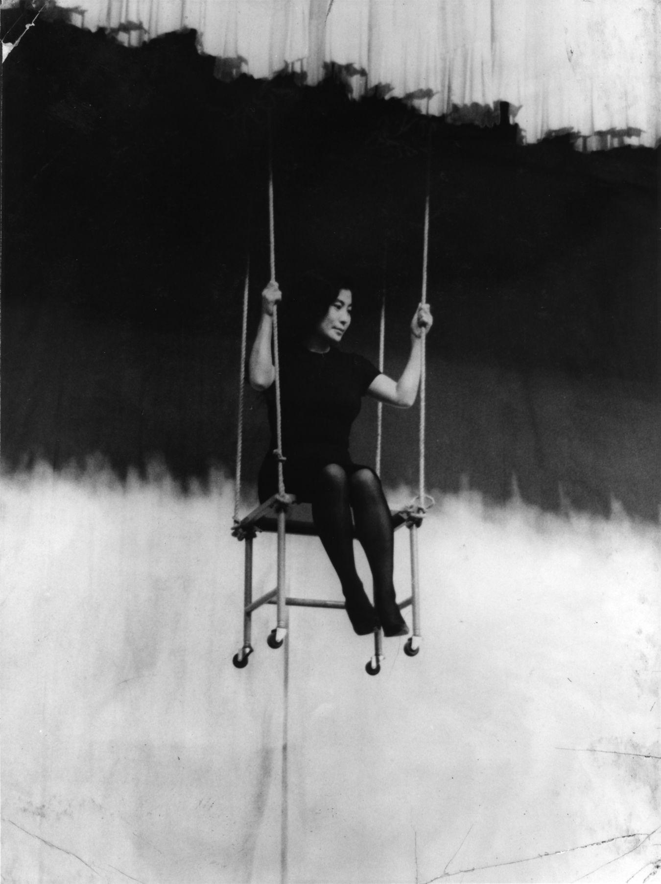 A young Yoko Ono on a swing.