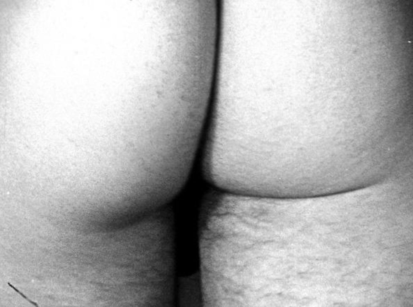 A black and white film still of a bottom.