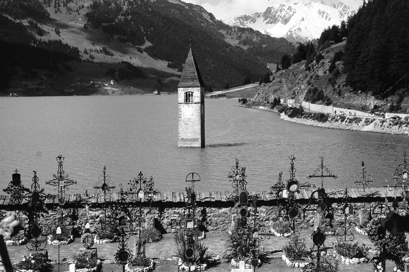 Bell tower of the village of Graun, Italy, submerged in Lake Reschen