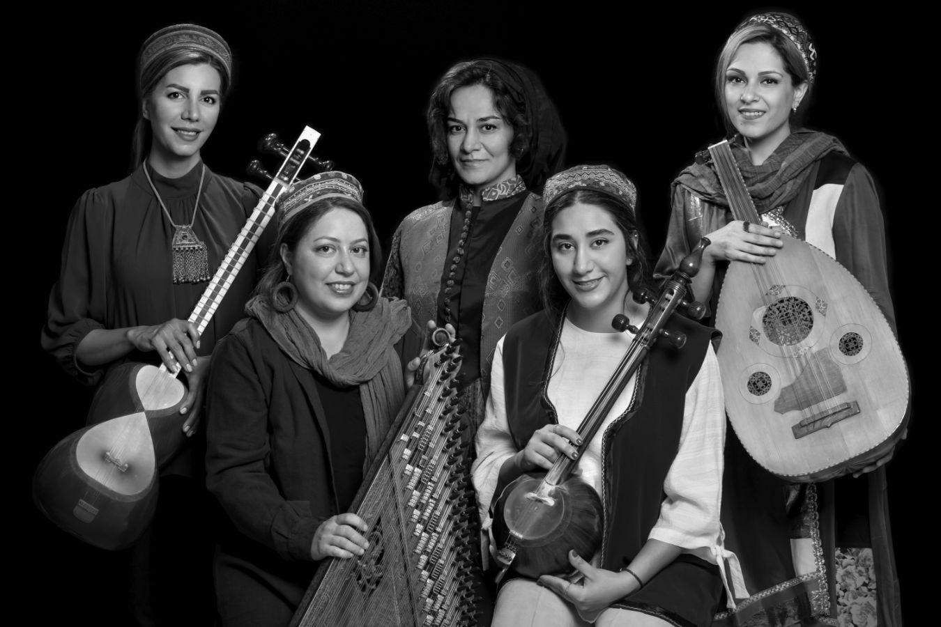 Five women in robes, four of them holding their plucked string instruments in their hands