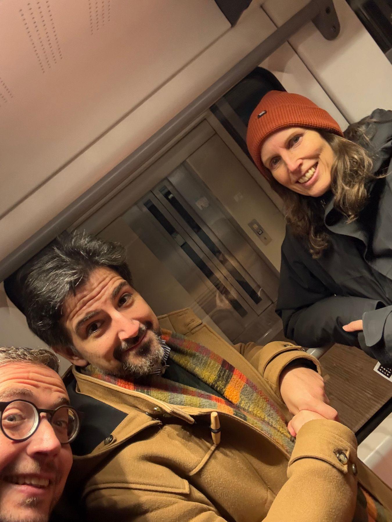 Selfie of Martin Thomas Pesl, Janis El-Bira and Eva Behrendt in the suspension railway