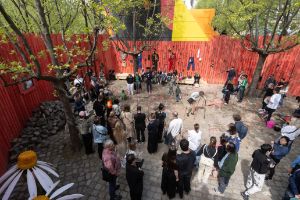 A group of people standing at an excavation site 