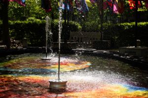 Two water fountains in a colorful water basin