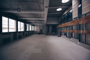 A room in the side wing of the Haus der Berliner Festspiele without flooring and partition walls.