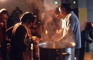 Installation view of Rirkrit Tiravanija's "untitled 2002 (demo station no. 3)". Tiravaniija is cookin in the installation for te opening in Sumida Riverside Hall Gallery, 2002, Tokio.