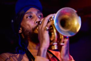 Close-up portrait of Jawwaad Taylor playing the trumpet
