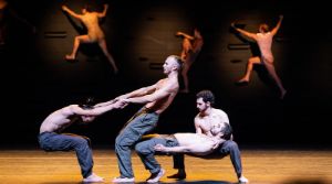 Performers dancing on stage.