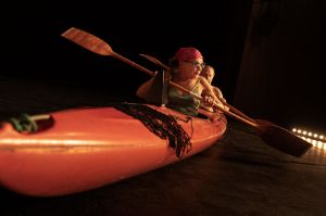 Two actors in a canoe.