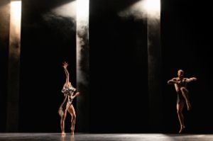 A woman and a man dance a duet.