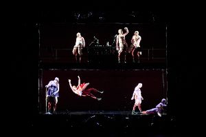 On one stage, only the performers are illuminated on two floors
