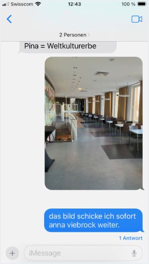Screenshot of a chat with a photo of a very stylish café or restaurant with white tables and lamps