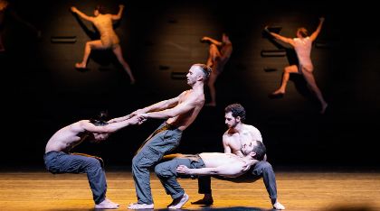 Performers dancing on stage.