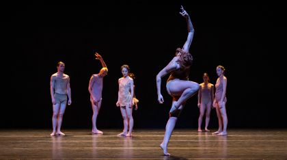 Performers dancing on stage.
